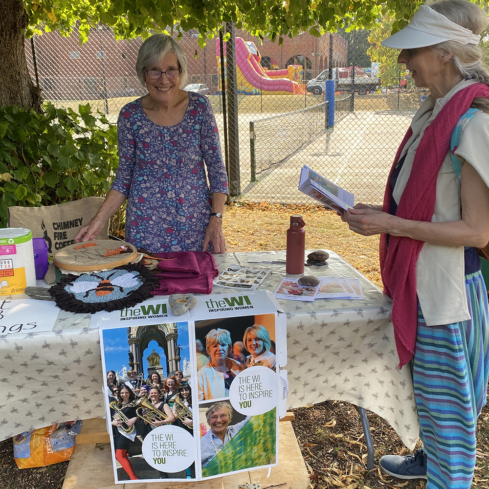 Rosemary demonstrating her amazing recycled crafting on the WI Stall at Pippfest 2024